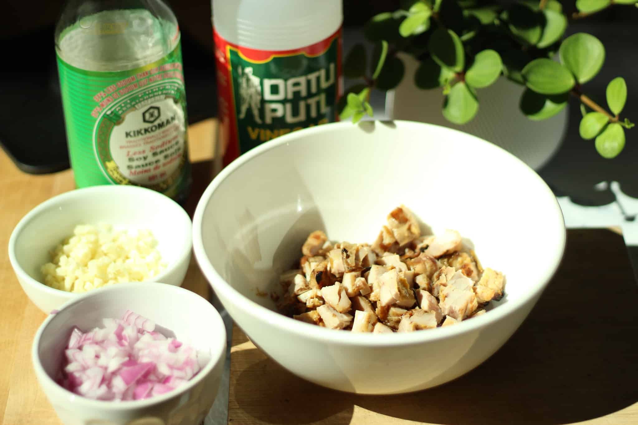 sizzling chicken chicharron chicken sisig with red onion, garlic, soy sauce, palm vinegar datu puti