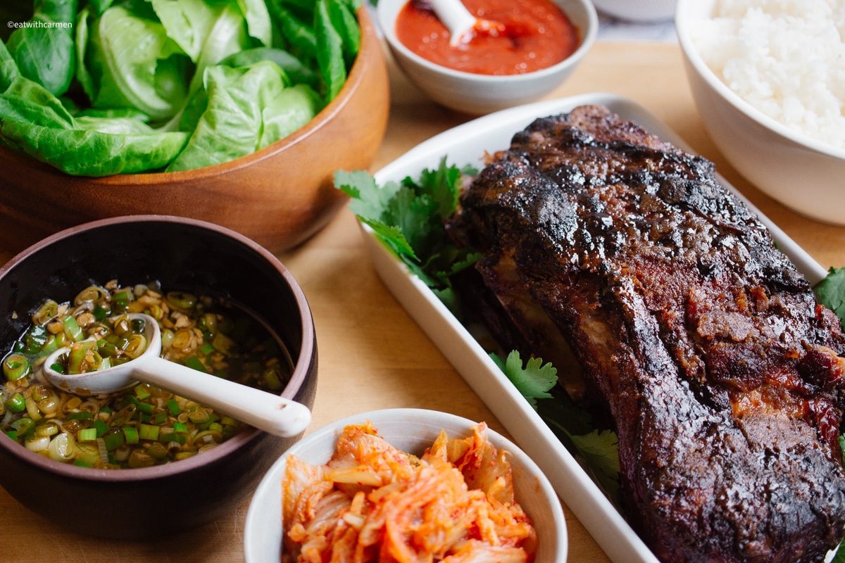 korean roast pork with rice, kimchi, ssamjang, ginger scallion, lettuce