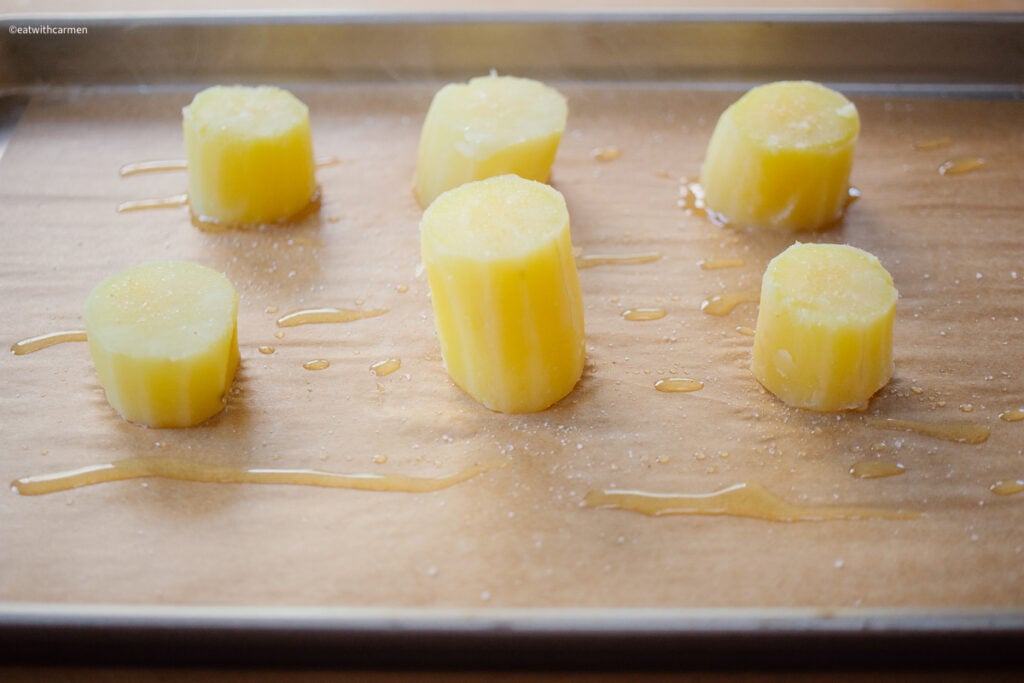 baking sheet sweet potato preparing to be smashed