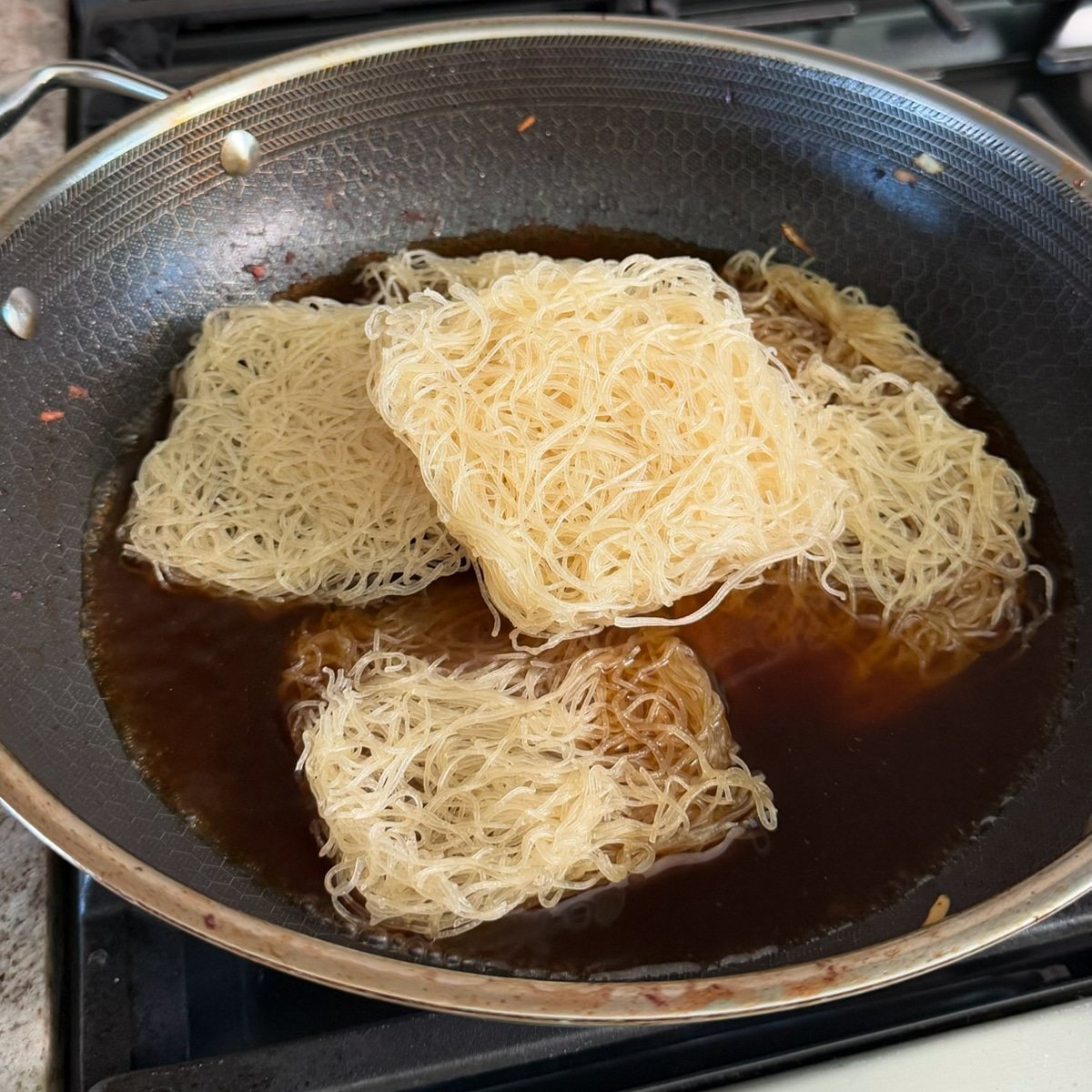add the bihon noodles. pancit chicken bihon