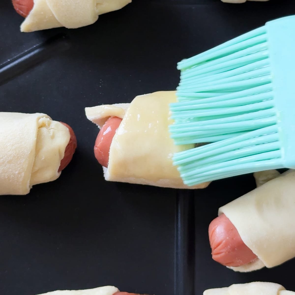 line them on to the air fryer basket and use a pastry brush to brush with egg wash 