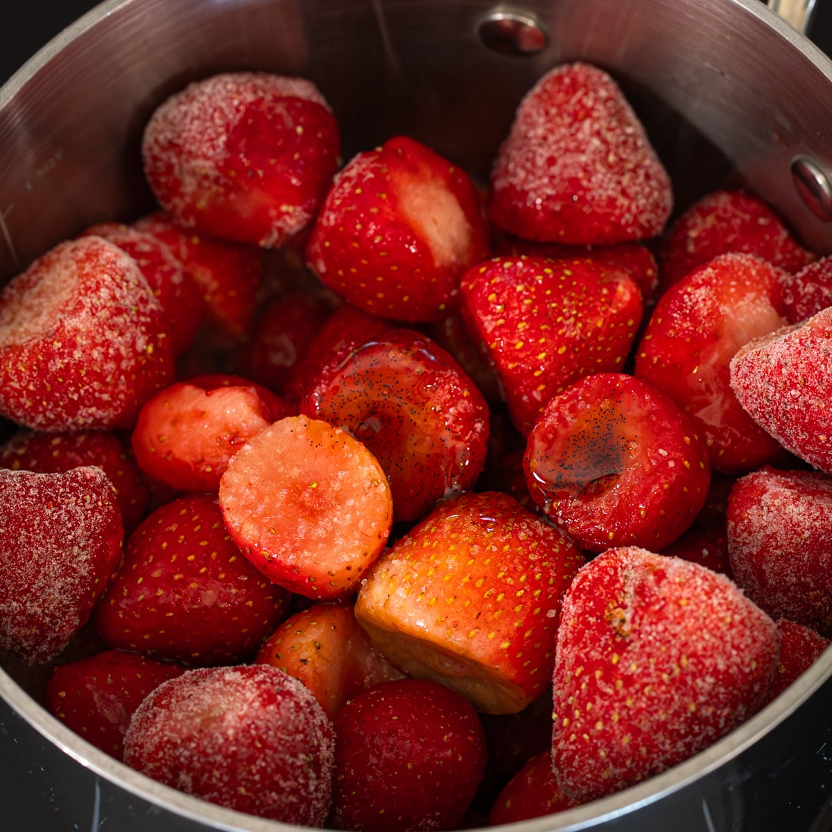 frozen strawberries in saucepan for homemade strawberry compote