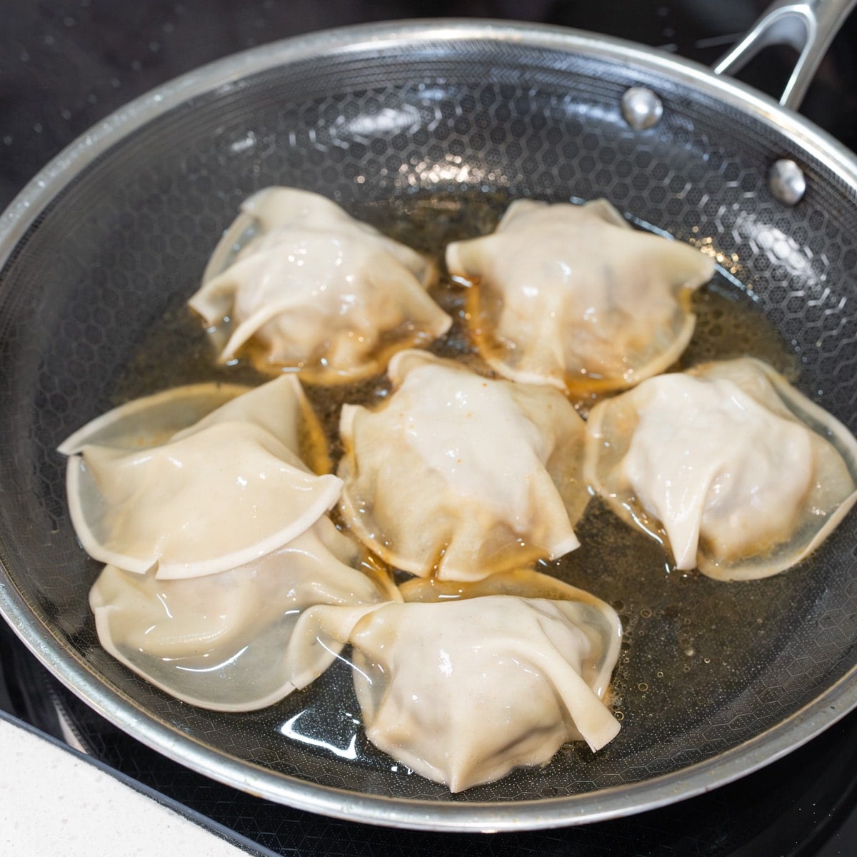 rice paper wrappers topping chicken and shiitake filling for crispy no fold dumplings