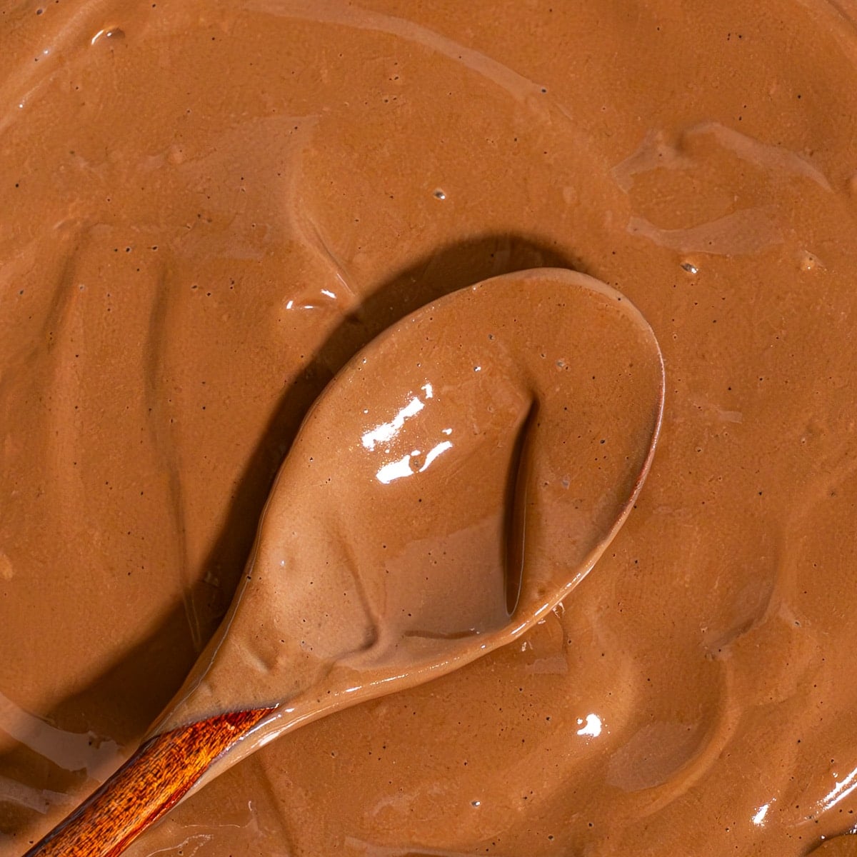 close up of boiled egg chocolate pudding with cocoa powder and honey