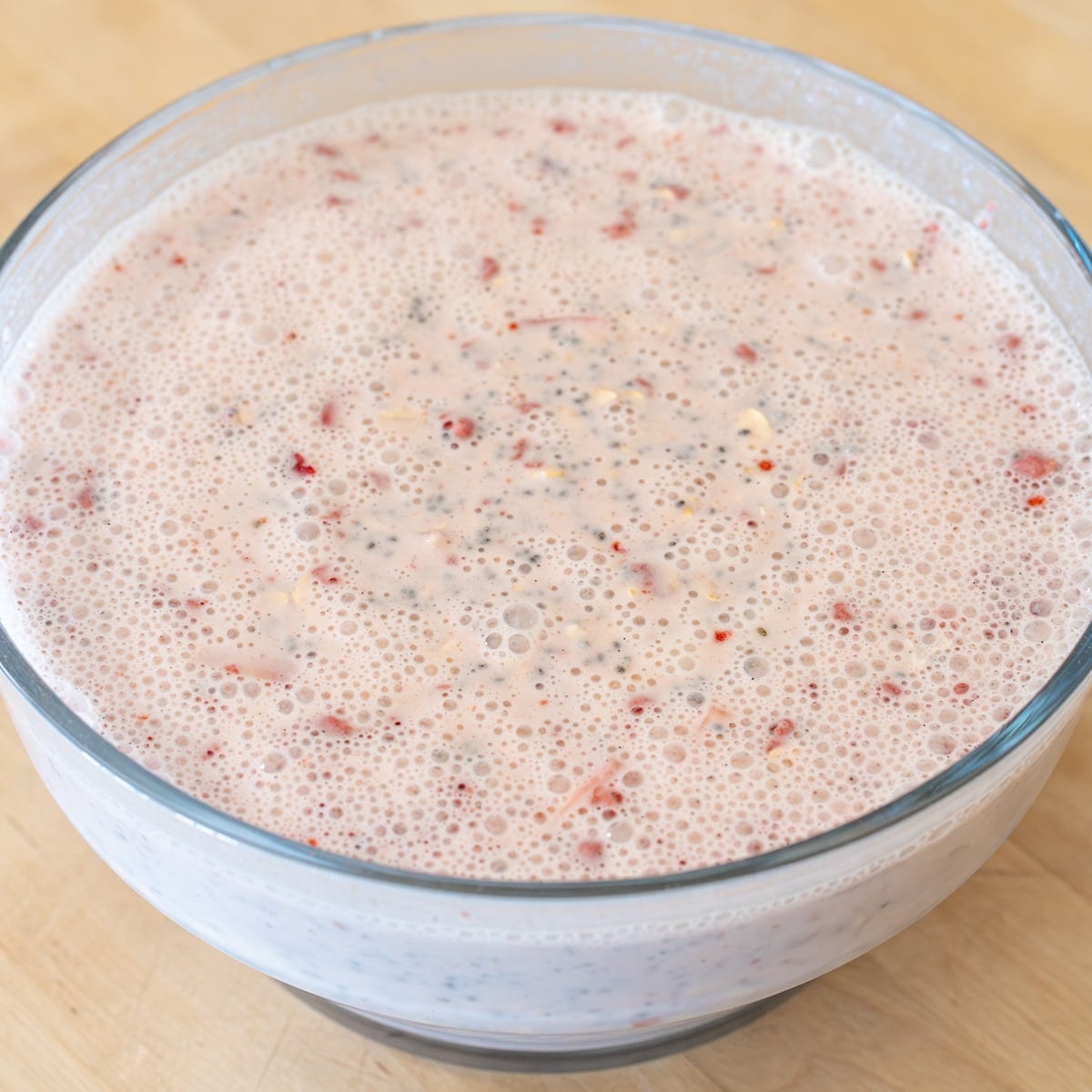 all ingredients added and ready to chill for strawberries and cream easy overnight oat recipe