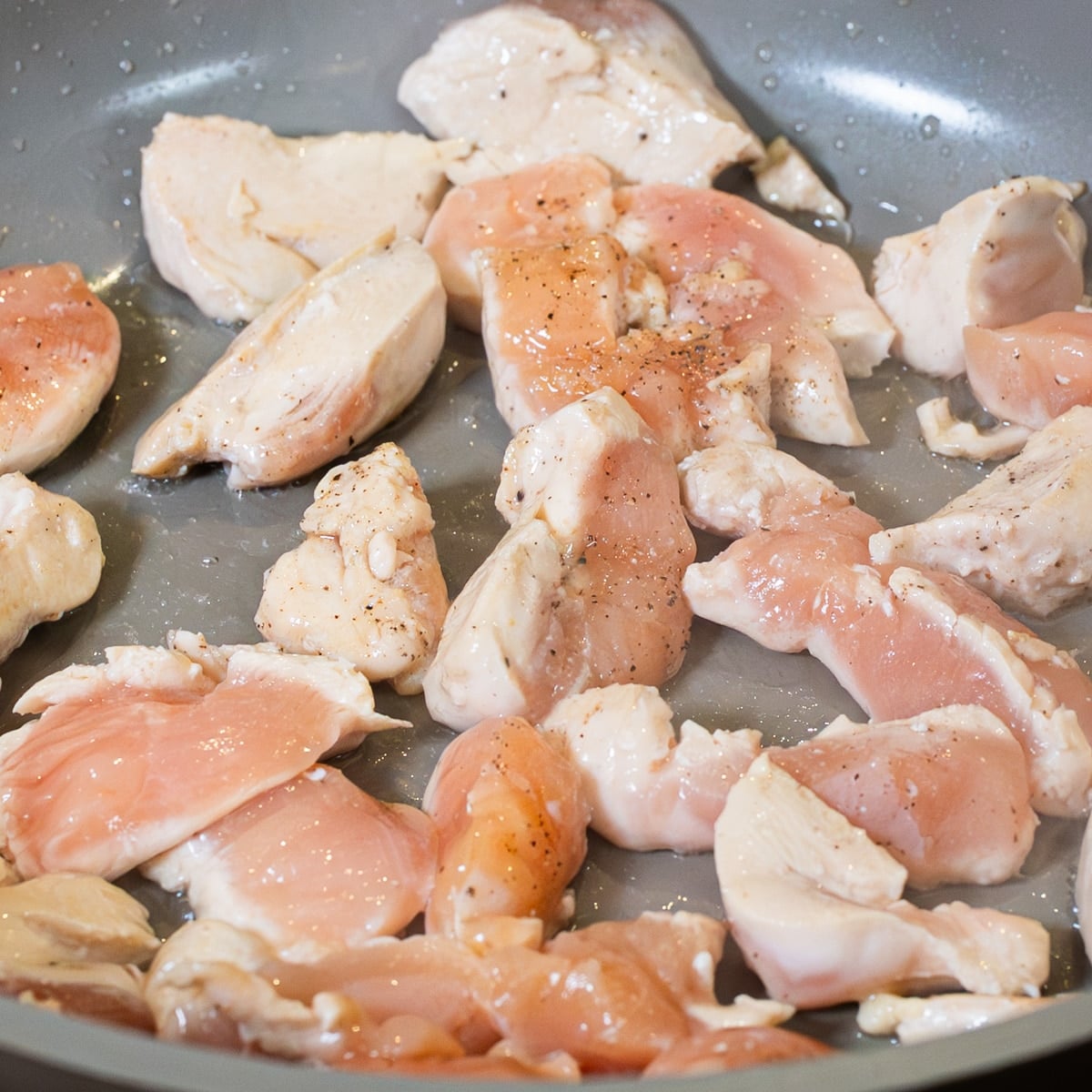 bite sized chicken pieces cooking for skillet chicken pot pie with leeks