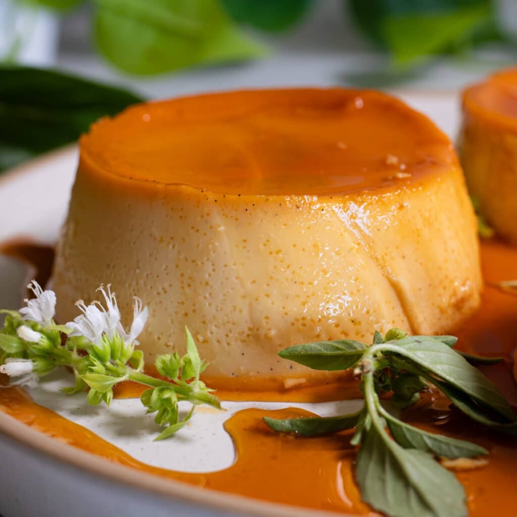 Creamy Filipino leche flan with caramel running down the sides