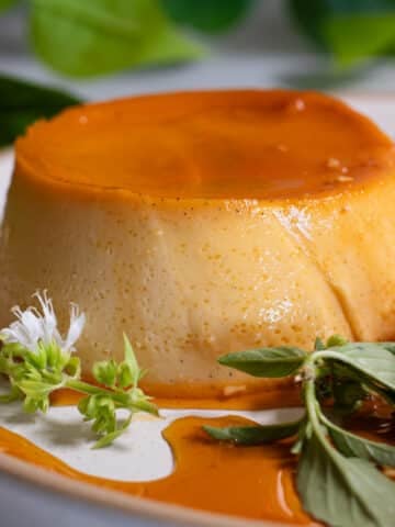 Creamy Filipino leche flan with caramel running down the sides